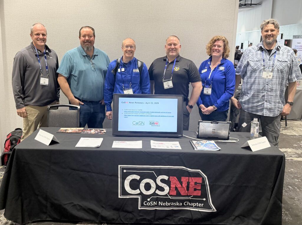 Photo of the CoSN Nebraska table and members in attendance
